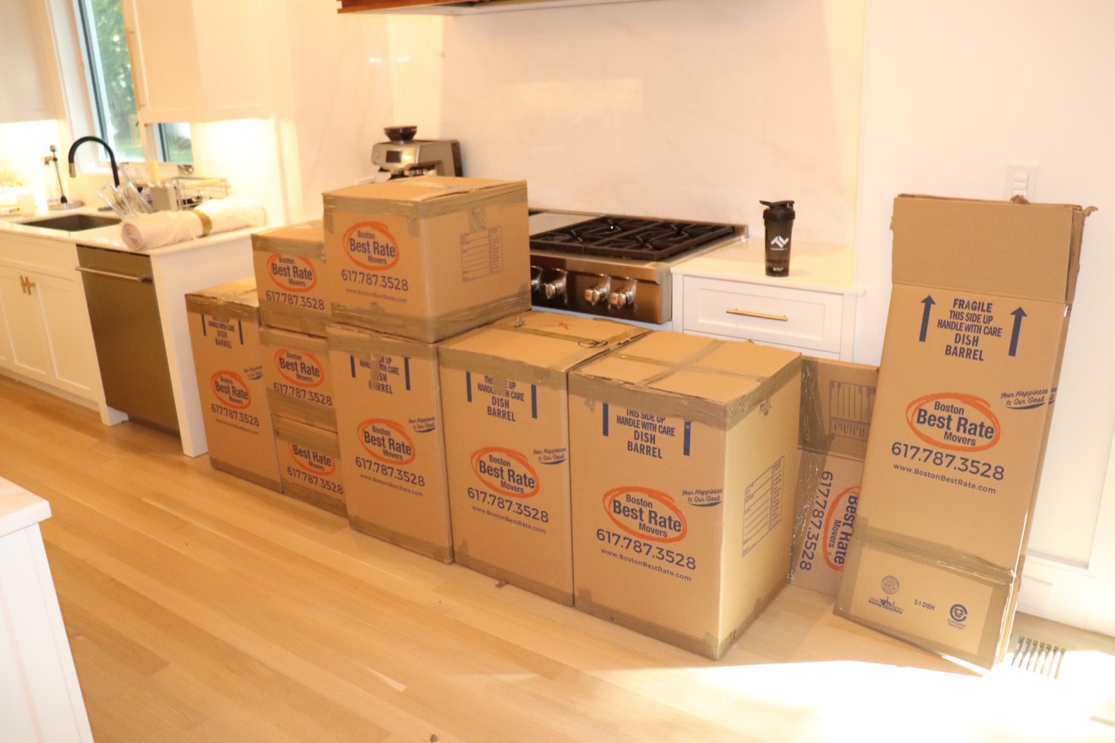 BBRM team carrying boxes into a new home