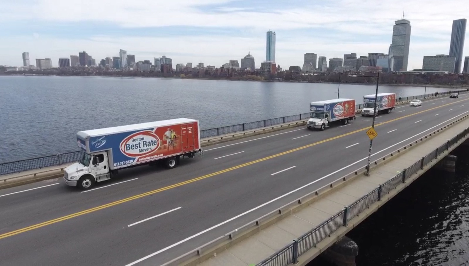 Boston Best Rate Movers truck parked outside home